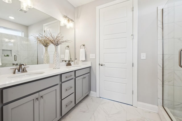 full bath with visible vents, marble finish floor, a stall shower, and a sink