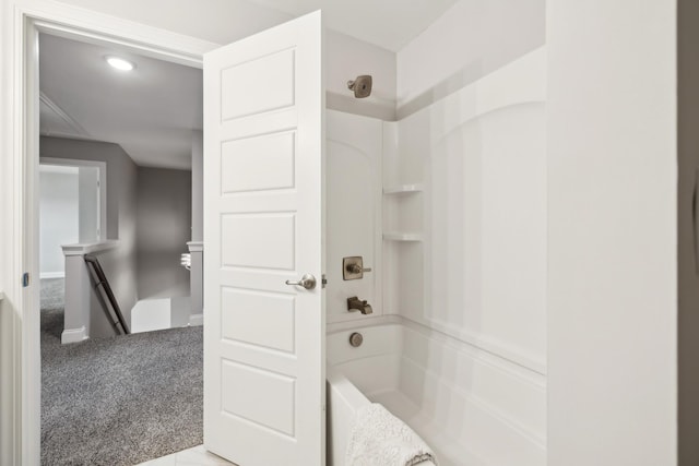 full bath featuring shower / tub combination and baseboards