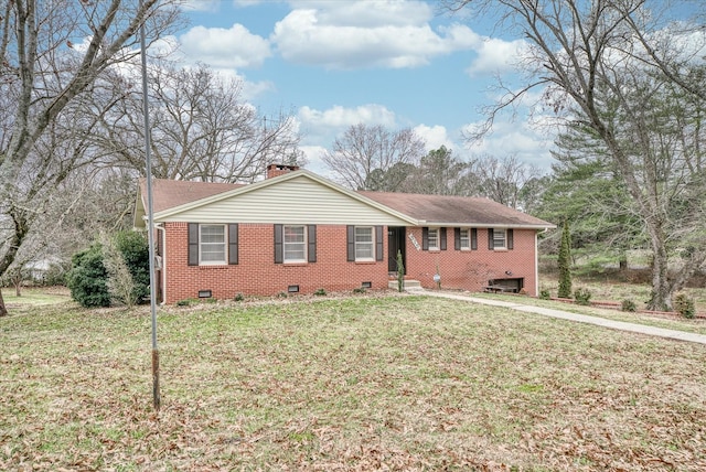 ranch-style home featuring a front lawn