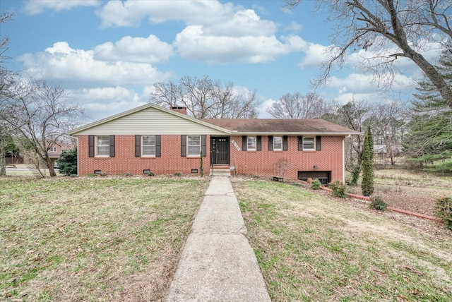 ranch-style home with a front lawn