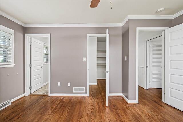 515 E 4th St, Cookeville, TN 38501 - unfurnished bedroom with multiple windows, wood finished floors, crown molding, and a ceiling fan