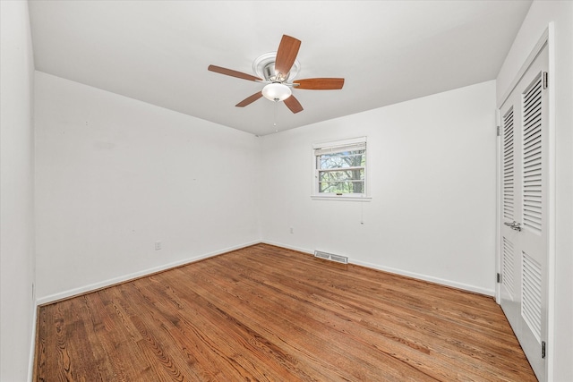 515 E 4th St, Cookeville, TN 38501 - unfurnished bedroom featuring wood finished floors, a closet, and ceiling fan