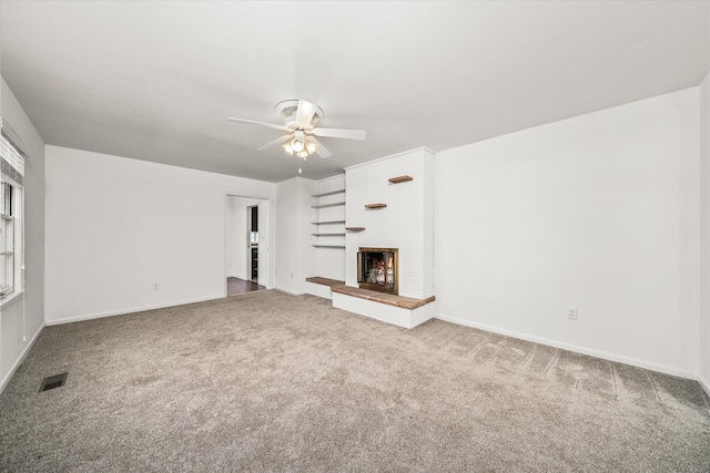 515 E 4th St, Cookeville, TN 38501 - unfurnished living room with carpet flooring, a ceiling fan, and a fireplace