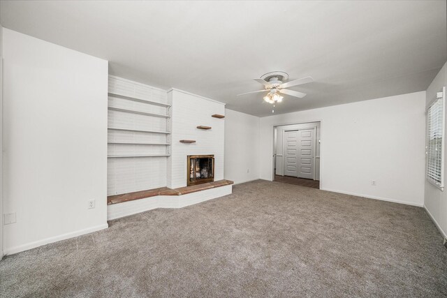 515 E 4th St, Cookeville, TN 38501 - unfurnished living room with ceiling fan, carpet floors, and a brick fireplace