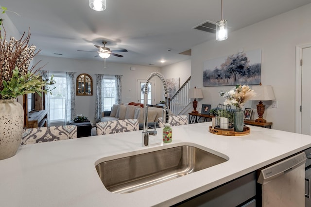 kitchen featuring sink, decorative light fixtures, dishwasher, and ceiling fan