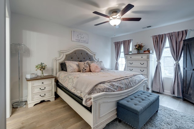 bedroom featuring ceiling fan and light wood-type flooring