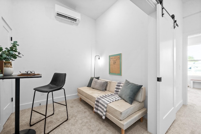 home office with a barn door, a wall mounted air conditioner, and light colored carpet