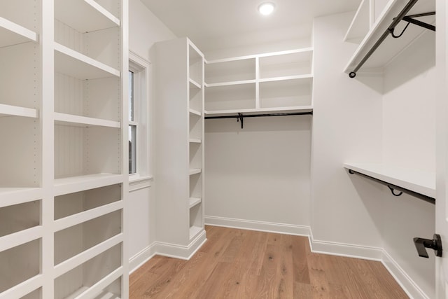 walk in closet featuring light wood-type flooring