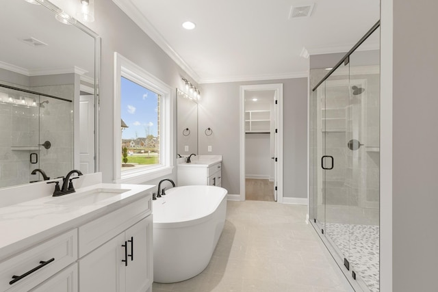 bathroom featuring independent shower and bath, ornamental molding, and vanity