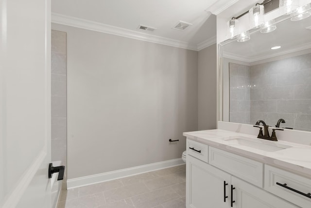 bathroom with ornamental molding, toilet, tile patterned flooring, and vanity