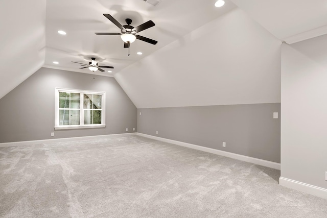 bonus room featuring light carpet and vaulted ceiling