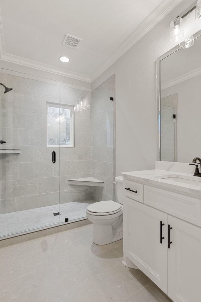 bathroom featuring a shower with door, ornamental molding, vanity, and toilet