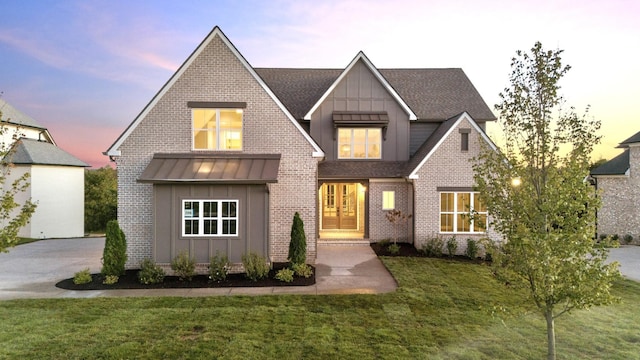 view of front of home with a yard