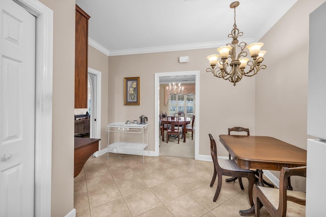 dining space featuring baseboards, an inviting chandelier, ornamental molding, and light tile patterned floors