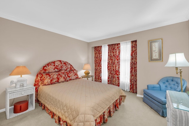 bedroom featuring ornamental molding, carpet flooring, and baseboards