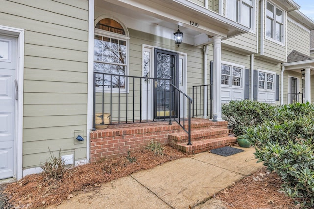 view of exterior entry featuring a garage