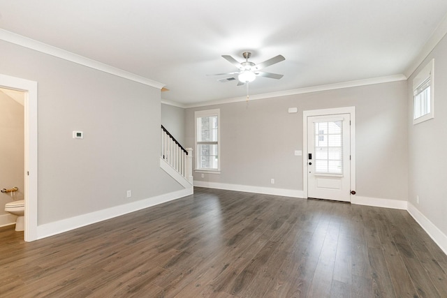 interior space with crown molding, ceiling fan, and dark hardwood / wood-style flooring