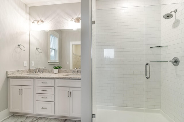 bathroom with vanity and an enclosed shower