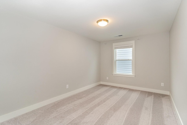 unfurnished room featuring carpet flooring