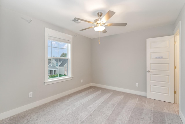 carpeted empty room with ceiling fan