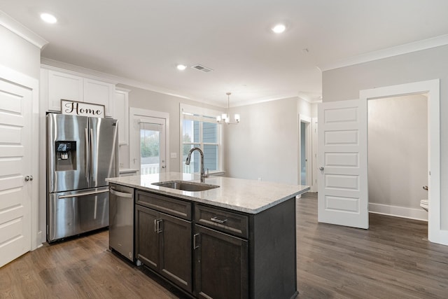 kitchen with sink, a kitchen island with sink, stainless steel appliances, light stone counters, and dark hardwood / wood-style flooring