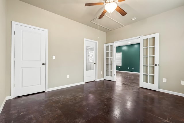 empty room featuring french doors and ceiling fan