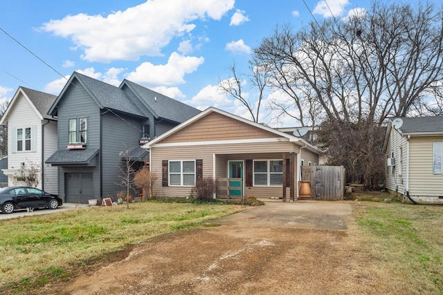 view of front of house with a garage and a front yard