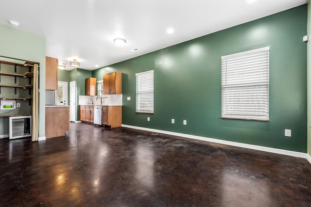 unfurnished living room with sink