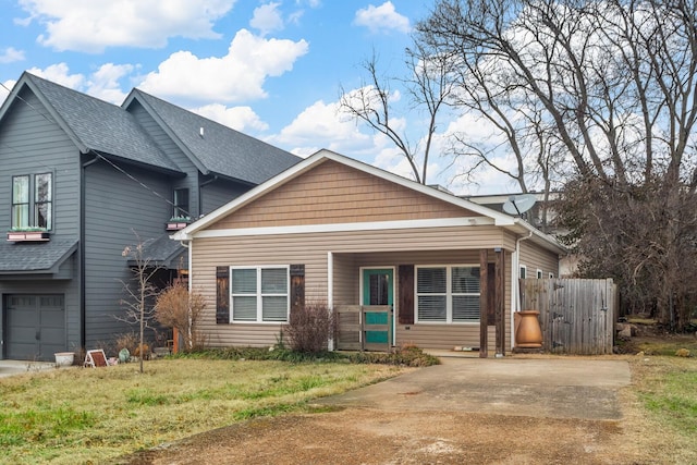 view of front of property with a garage and a front lawn