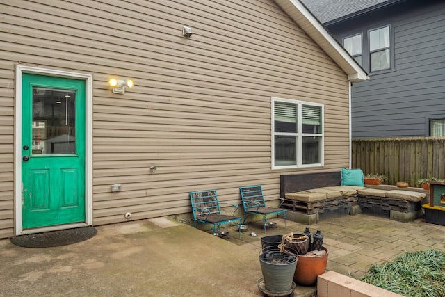 entrance to property with a patio area