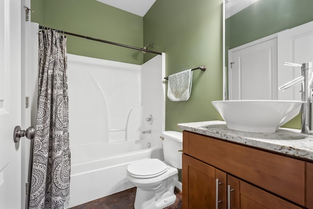 full bathroom featuring vanity, shower / tub combo with curtain, and toilet