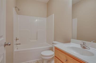 full bathroom featuring vanity, shower / washtub combination, and toilet