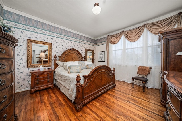 bedroom with crown molding and dark wood-type flooring