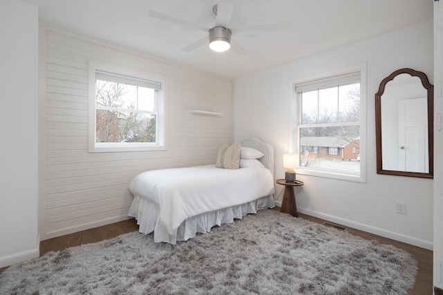 bedroom featuring dark hardwood / wood-style flooring and ceiling fan