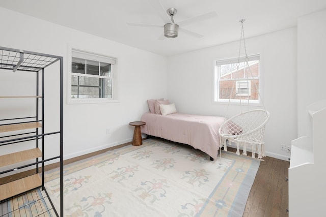 bedroom featuring ceiling fan and wood-type flooring