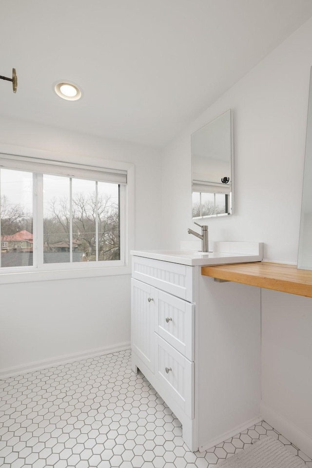 bathroom with tile patterned flooring and sink