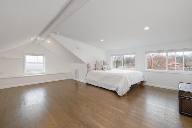 bedroom with dark hardwood / wood-style floors and vaulted ceiling with beams