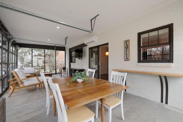 dining space with brick wall and a wall unit AC