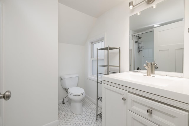 bathroom featuring vaulted ceiling, a shower with shower door, tile patterned flooring, vanity, and toilet