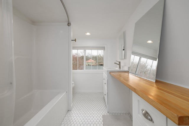 full bathroom with tile patterned floors, vanity, toilet, and  shower combination