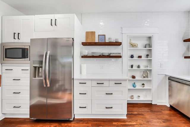 kitchen featuring white cabinetry, appliances with stainless steel finishes, and dark wood-type flooring