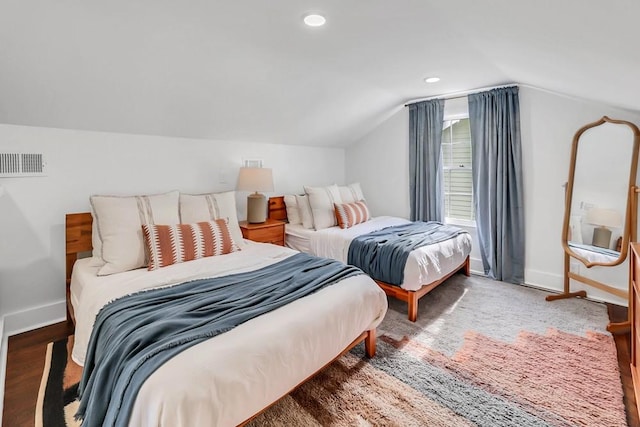 bedroom featuring wood-type flooring and vaulted ceiling