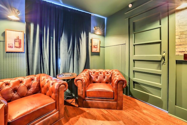 home theater room featuring wood-type flooring