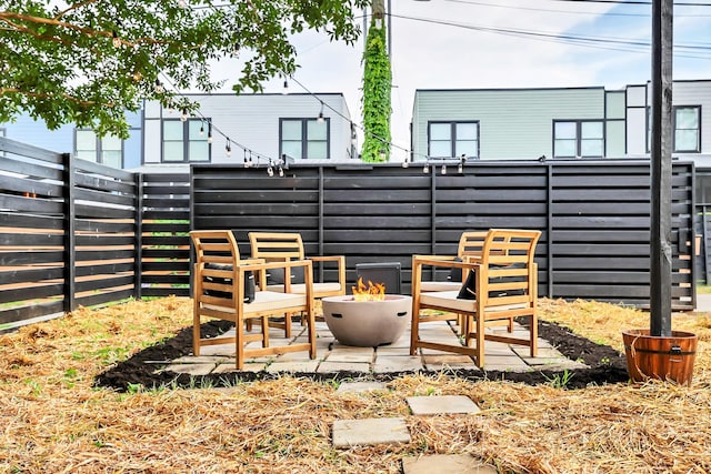 view of patio with an outdoor fire pit