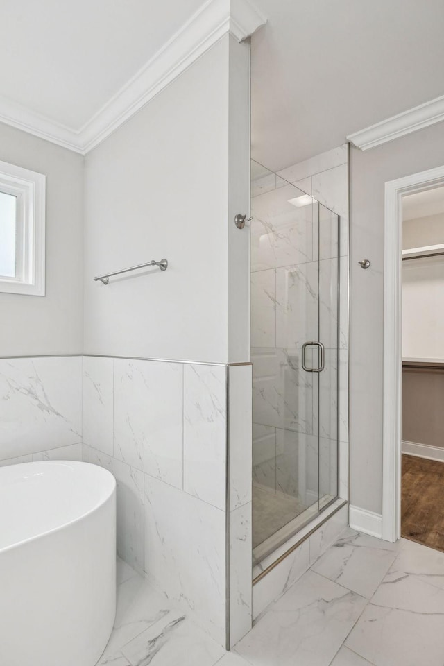 bathroom featuring crown molding and independent shower and bath