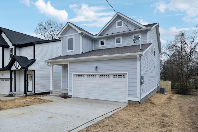 view of front of property with a garage and central air condition unit