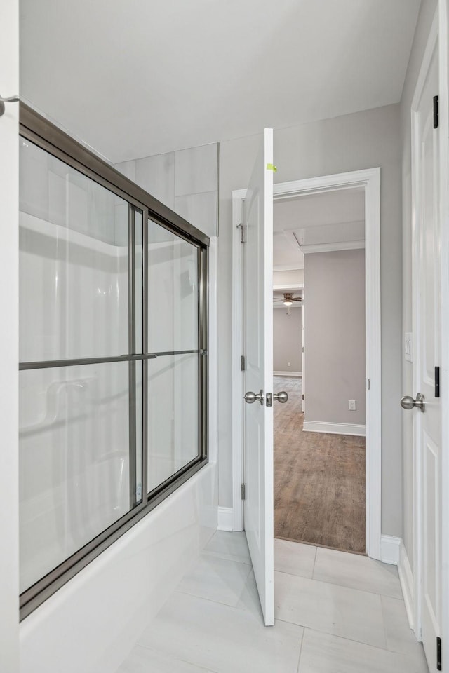 bathroom with shower / bath combination with glass door