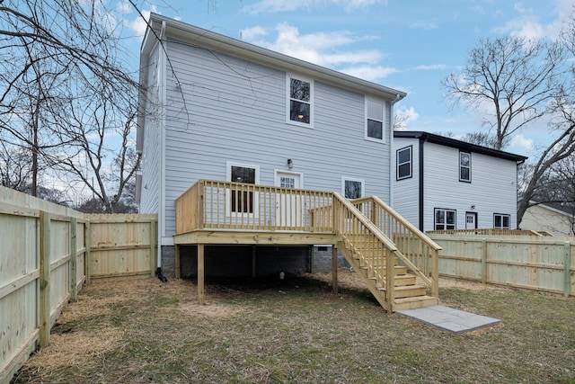 rear view of property featuring a deck