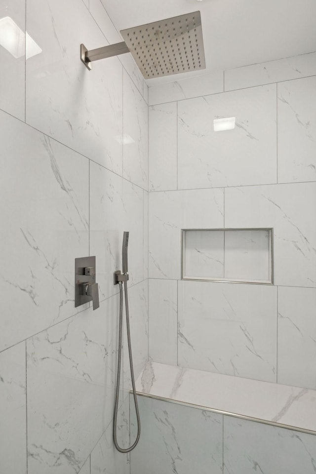 bathroom featuring tiled shower