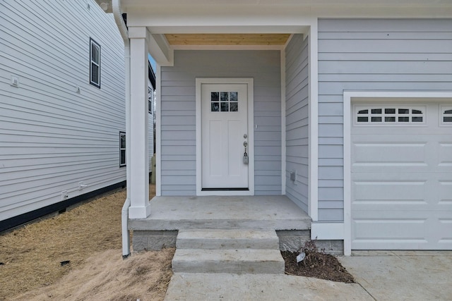 view of exterior entry featuring a garage